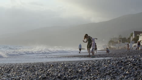 family enjoying the beach on a summer day