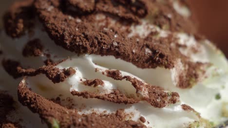 close up of whipped cream with cocoa powder