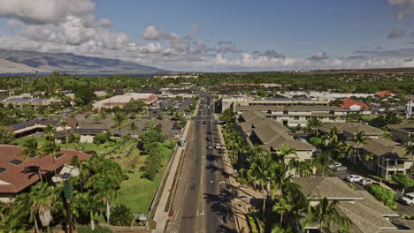 kihei maui hawaii aerial v4 drone fly along the main road capturing the town center of the island with west maui forest reserve mountain views on the skyline - shot with mavic 3 cine - december 2022