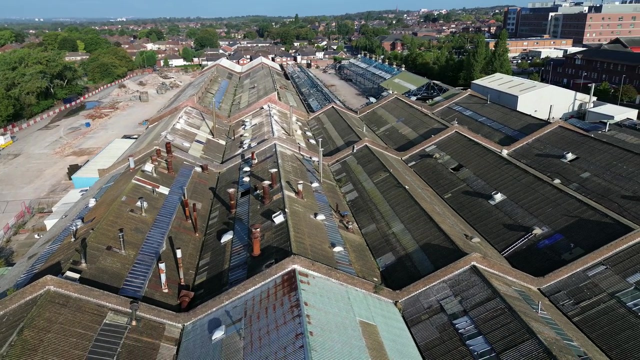 British Glen Dimplex factory aerial view over huge hazardous asbestos workshop site rooftops