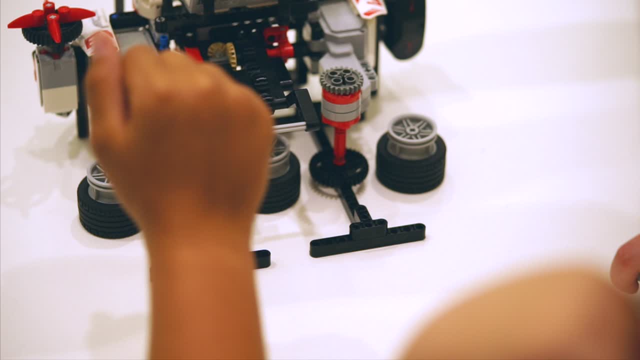 Child Building a LEGO Robot