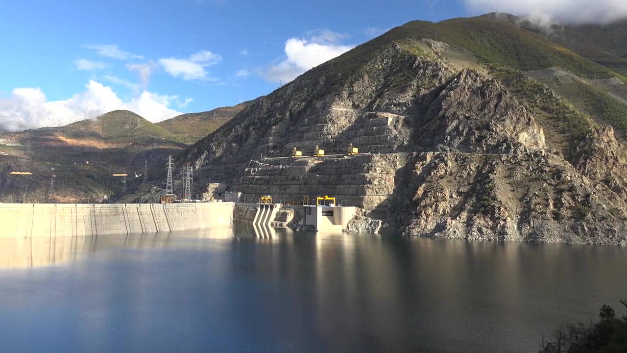 Large Concrete Dam and Reservoir in Mountainous Landscape