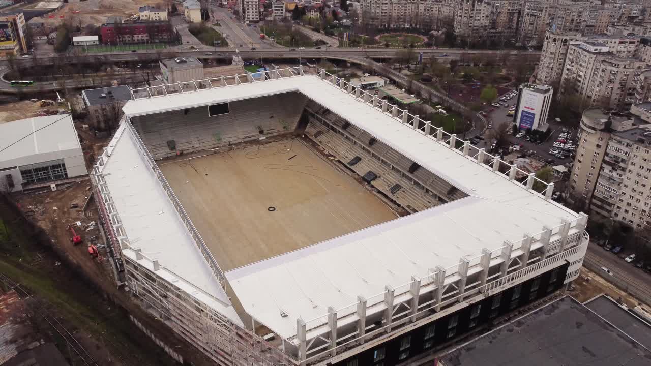 Football Stadium Under Construction. Aerial Footage Of Soccer Field