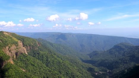 mountain range with bright blue sky at morning from flat angle video taken at seven sister waterfalls cherrapunji meghalaya india
