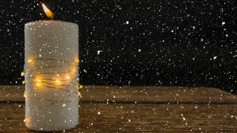 falling snow with christmas candle decoration