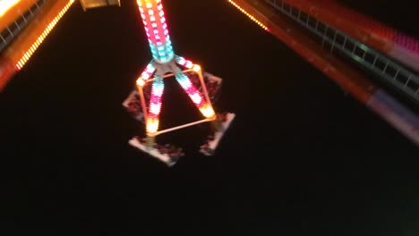 crazy carnival ride shot at night.