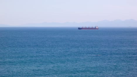 View-of-a-Bulk-Cargo-Ship-slowly-moving-through-the-ocean
