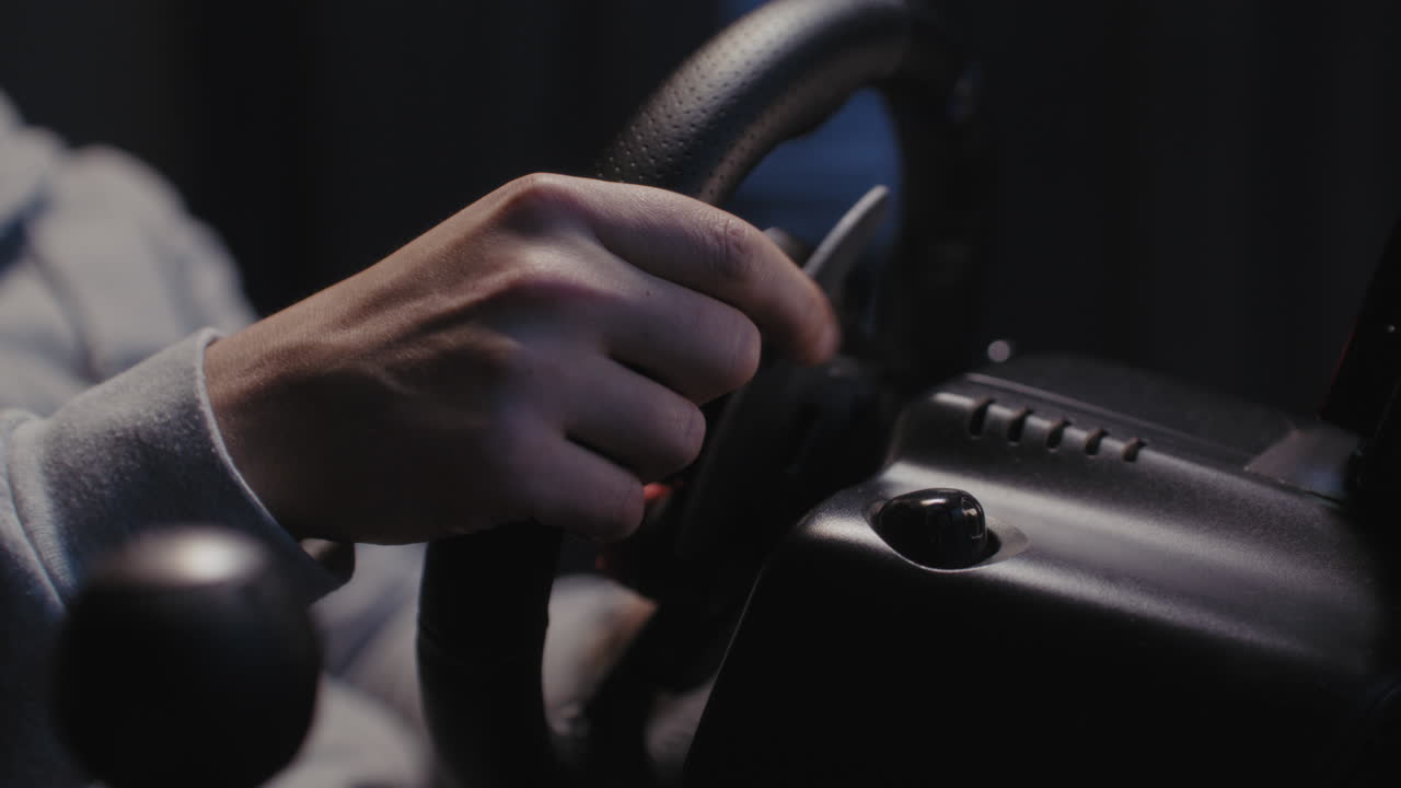 Person using a racing wheel