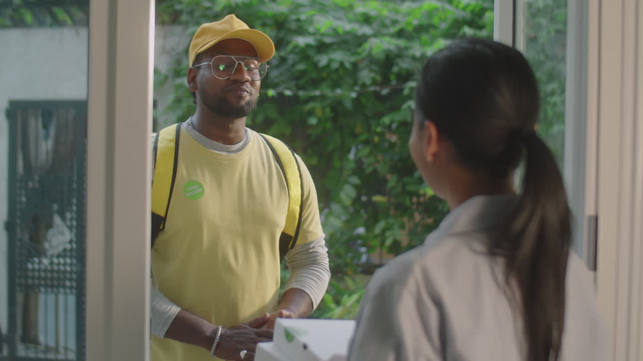 Courier Delivering Food for Woman at Home