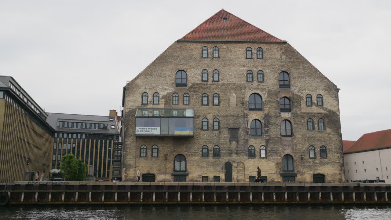 Street view of the Gammel Dok former warehouse on the waterfront of the Inner Harbour in the Christianshavn neighbourhood of Copenhagen, Denmark