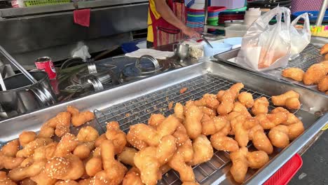 sequential frying and serving of street food snacks