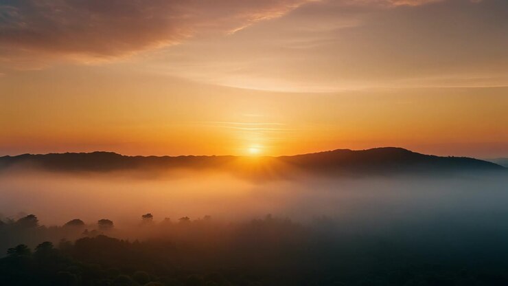 Golden Sunrise Over Misty Mountain Landscape