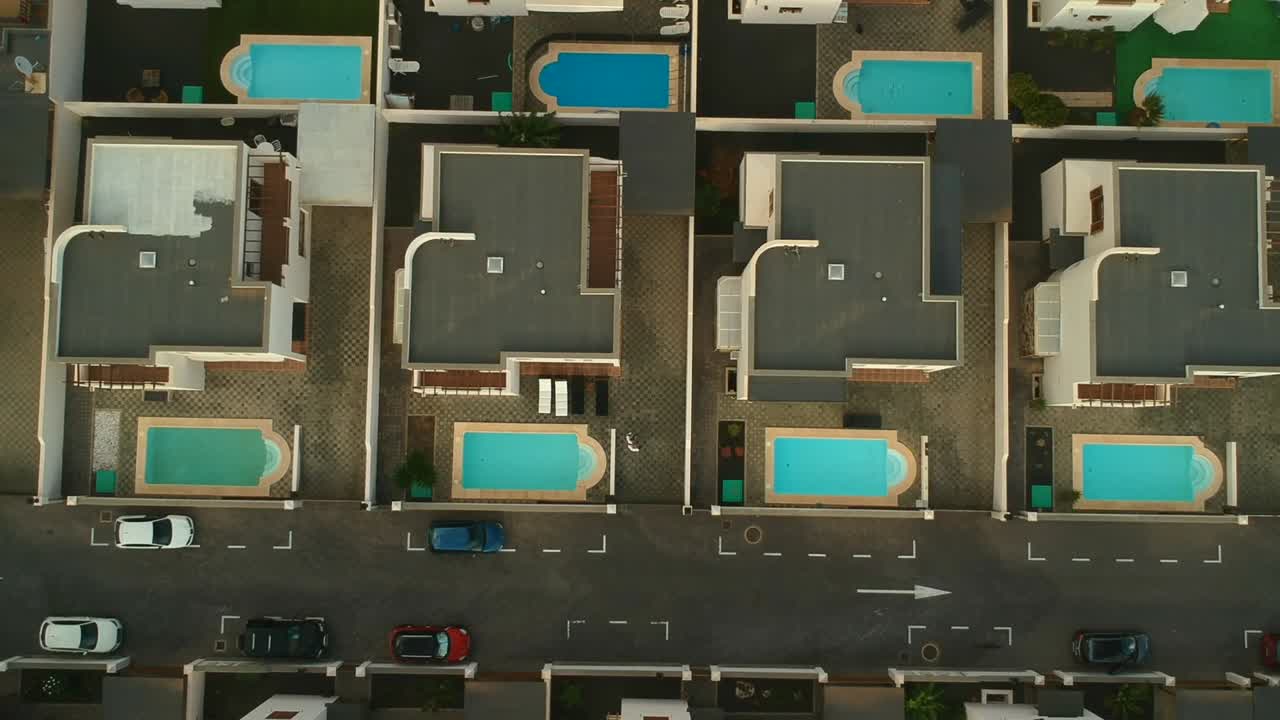 Aerial view of luxury houses with swimming pools