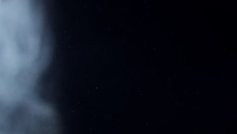 fondo negro de 4k de partículas, polvo y humo en movimiento
