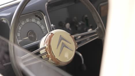 close-up of a classic citroen car's steering wheel