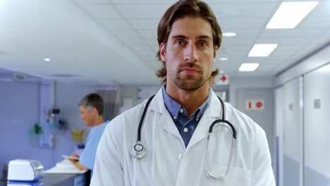 male doctor writing on clipboard in the hospital 4k