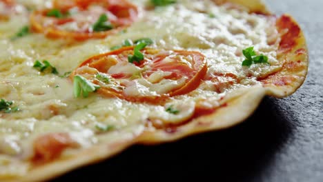 baked pizza with cherry tomato toppings