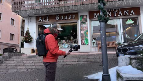 freelance content creator using gimbal to film content in cortina d'ampezzo