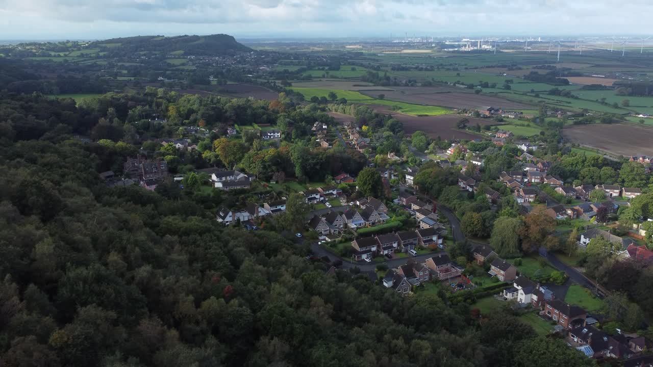 Aerial view above Cheshire North England viewpoint out across Snowdonia North Wales vast countryside descending hillside