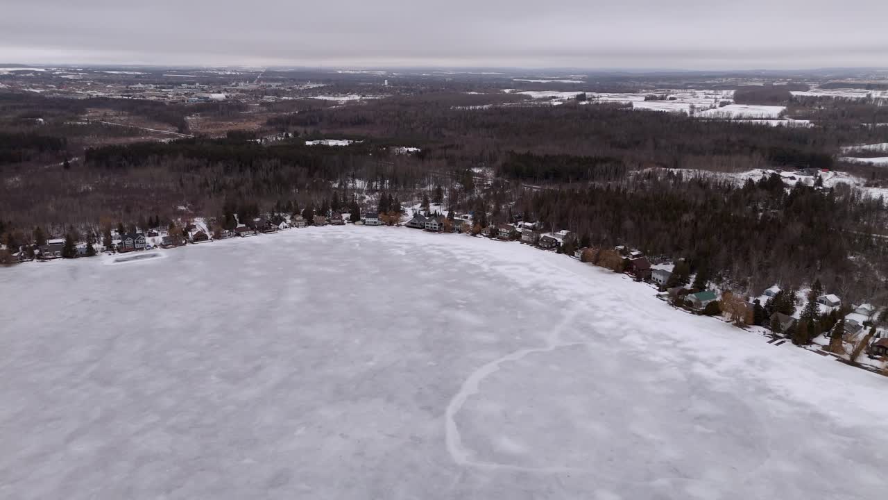 Aerial Drone Landscape of Snow Covered Cottages at Caledon Lake Near Orangeville, Ontario, Canada