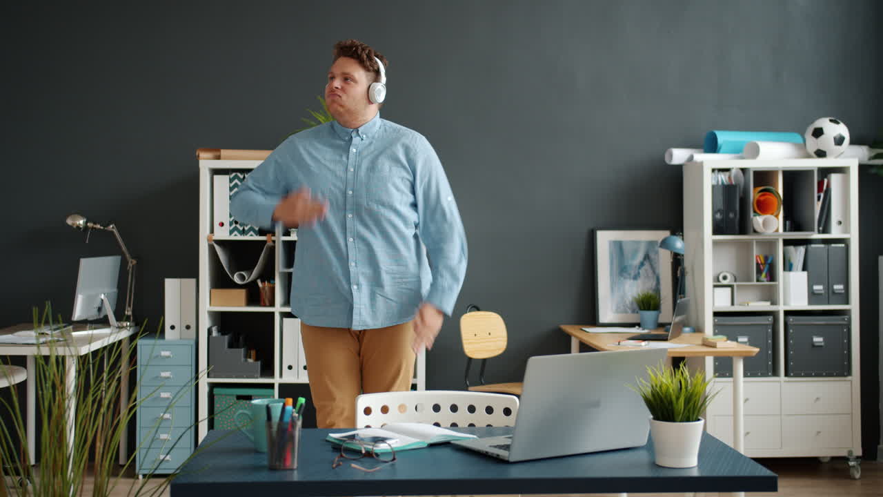 Man enjoying music in a home office