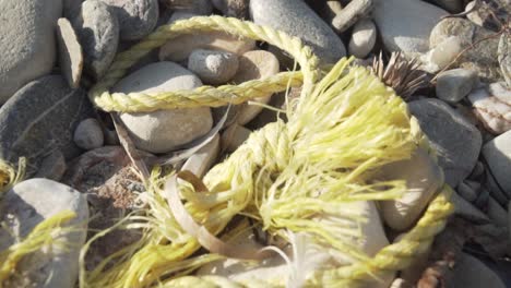 yellow rope among beach rocks