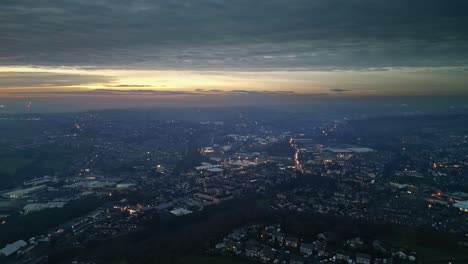 drone sunset flight over busy urban highway at night cars lights moving junction