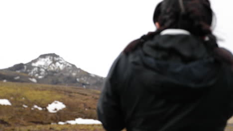 Girl-Taking-Photo-of-Iceland-Mountain-in-Slow-Motion