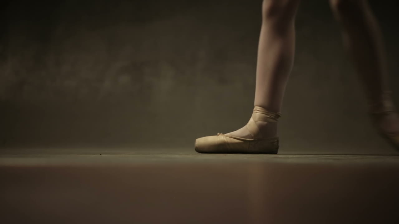 Girl Ballerina Posing In Studio. Young incredibly beautiful girl ballerina posing and dancing in a black studio