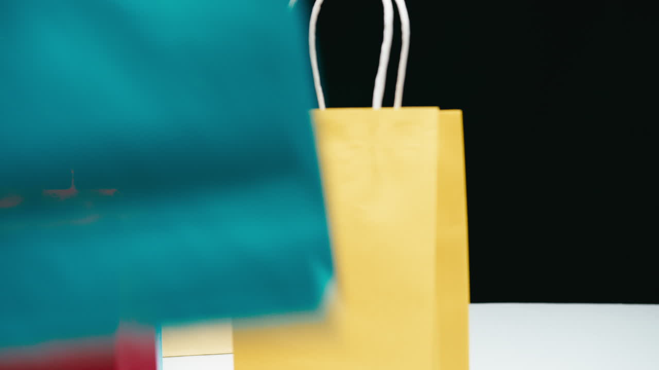 Black Friday gift bags in a store frantically swapped with a black background