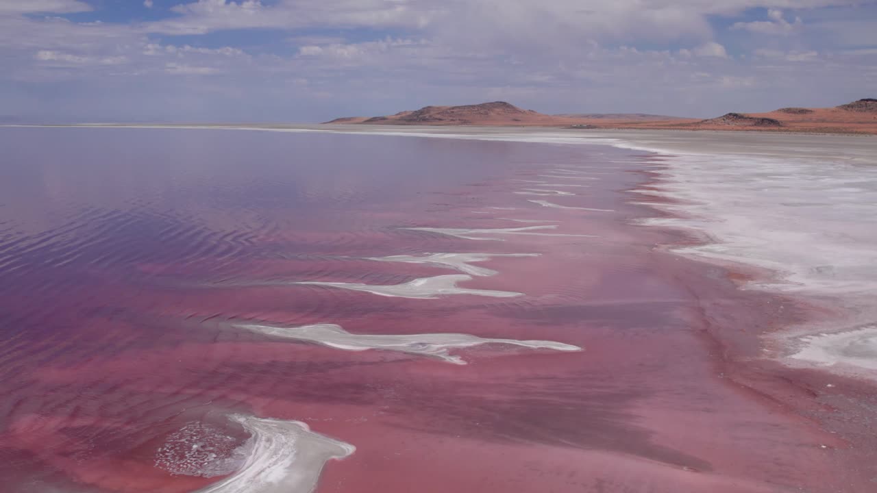Pink colored waters of northern Great Salt Lake, Utah from an aerial drone perspective