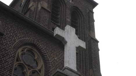 footage of a cross in front of a church in germany