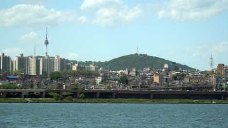 n seoul tower at namsan mountain, yongsan district city panorama view from the bank of han river daytime static