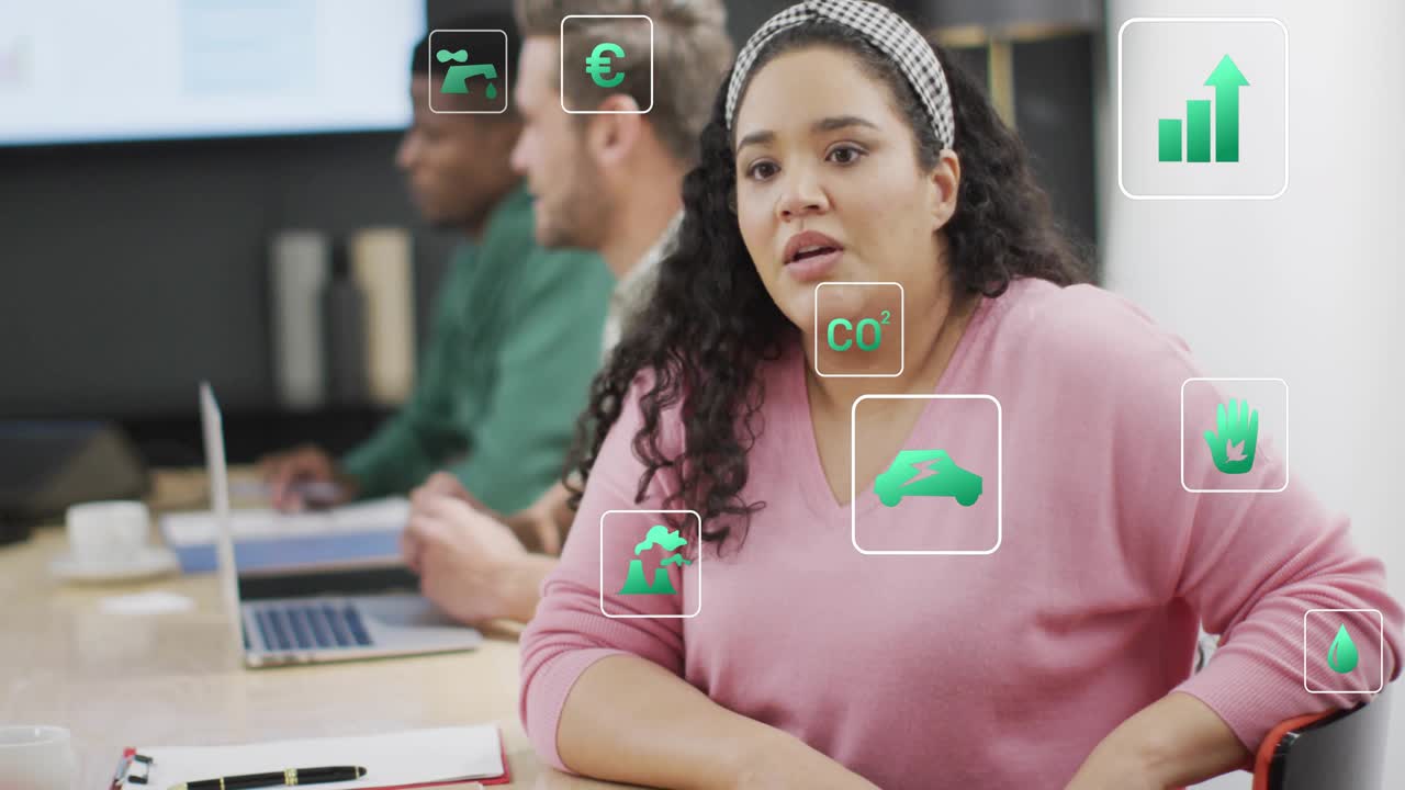 Woman in pink top discussing CO2 goals, gesturing, icons clustering near hands, cam moving