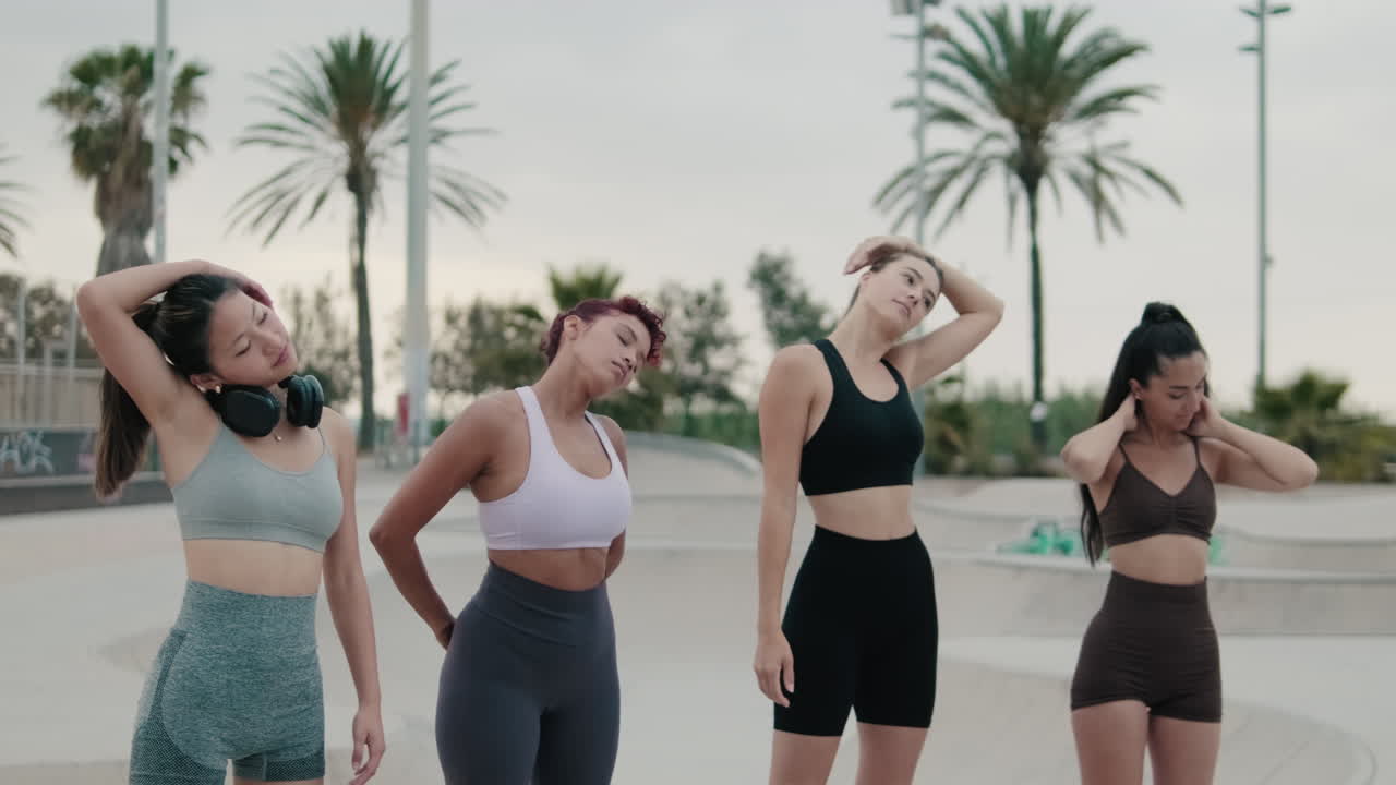 Diverse Women Warming Up at Outdoor Gym
