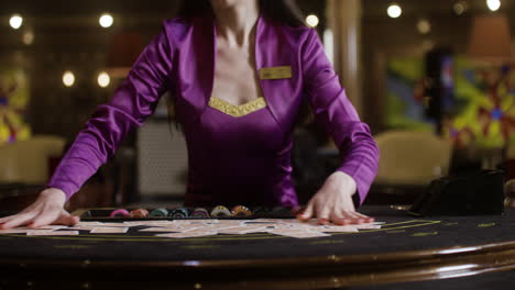 croupier shuffling poker cards.