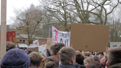 young people demonstrating for enviromental protection