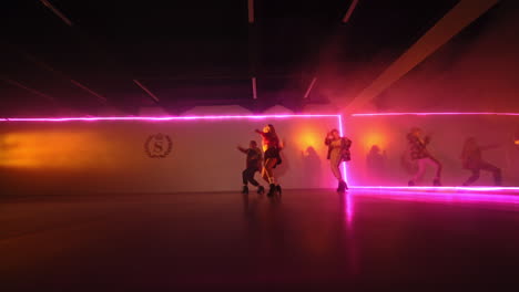 dance performance in a neon lit studio