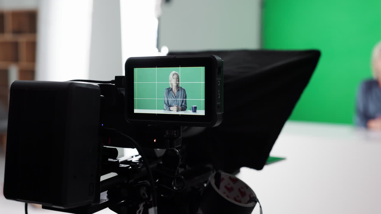 Camera recording a woman in a studio