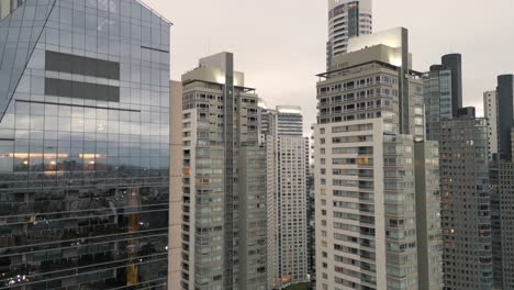 Ascending-drone-view,-skyscrapers-in-downtown-Buenos-Aires,-Argentina