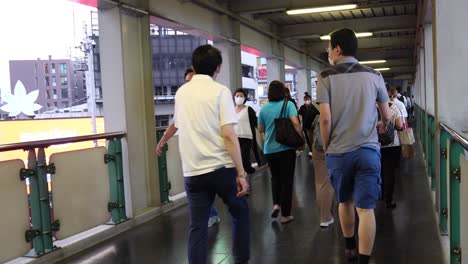 people transit in a busy station walkway