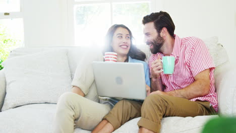 Couple-looking-at-tablet-