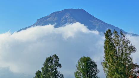 mount sumbing surrounded by white clouds, indonesia