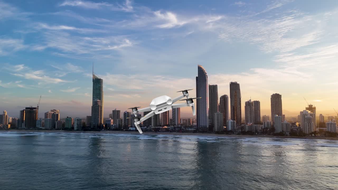 A drone smoothly navigates above a city skyline by the ocean during a vibrant sunset, capturing dynamic aerial views