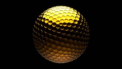 gold golf ball isolated on black background.