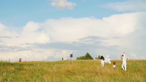 family enjoying a day out in a field