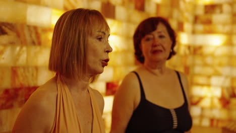 two women relaxing in a salt room spa