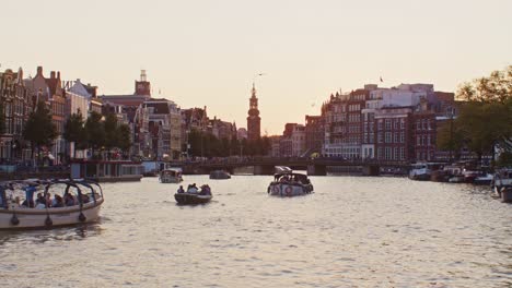 a beautiful lovely nice romantic sightseeing view point in the city town of the netherlands, sunset in amsterdam water canals, dutch holland authentic european look