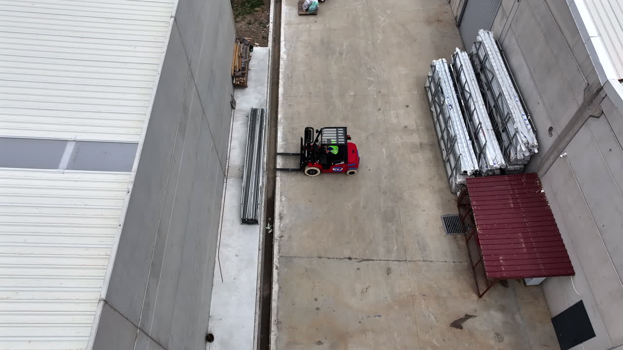 Aerial View of Forklift Handling PVC Materials in Factory