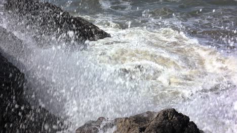 4k footage of stormy waves crashing on a rocky shore